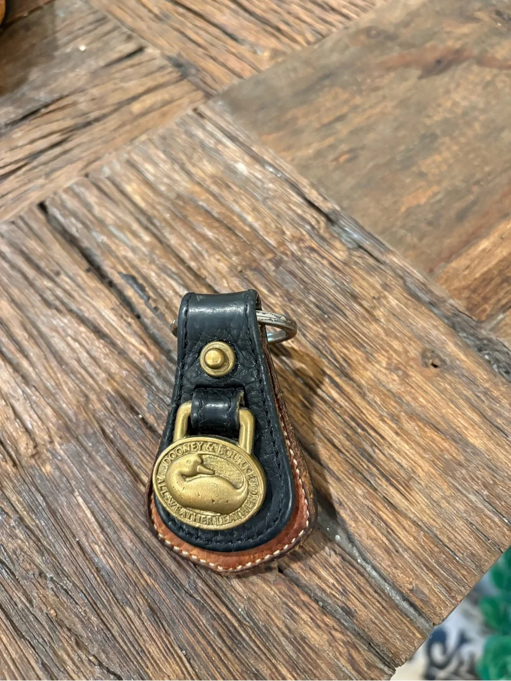 Dooney & Bourke Black and Brown Leather Key Fob with Brass Duck Medallion